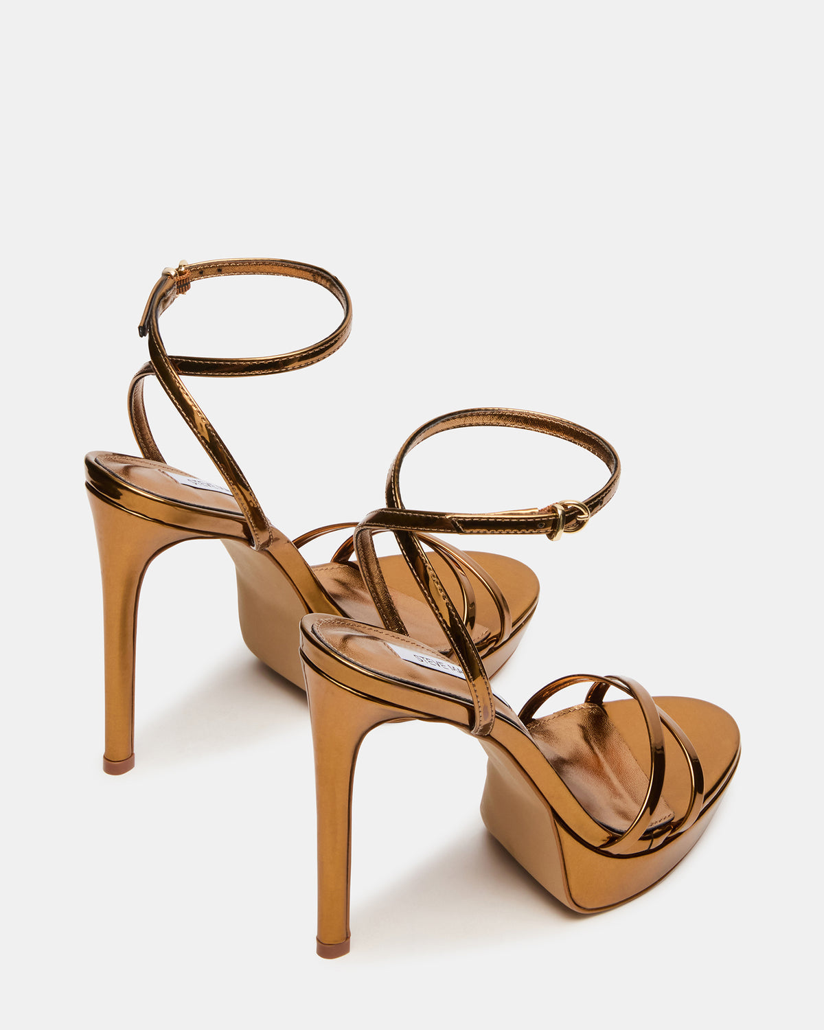 JUNI Bronze Criss Cross Stiletto Ankle Strap Women's Heel | Steve Madden Customer Favorite