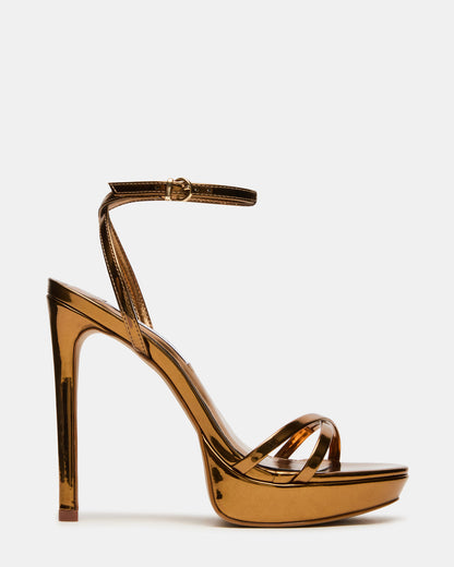 JUNI Bronze Criss Cross Stiletto Ankle Strap Women's Heel | Steve Madden Customer Favorite