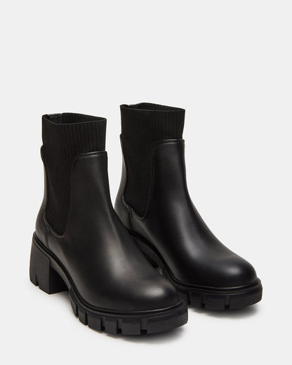 HUTCHH20 Black Water-Resistant Lug Sole Ankle Boot | Women's Booties | Steve Madden Best Seller