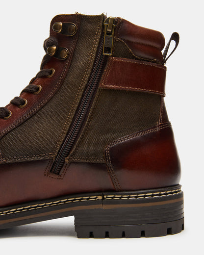 REID Cognac Lace-Up Lug Men's Ankle Boot | Steve Madden Customer Favorite