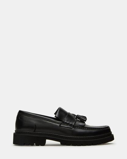 ARTHUS Black Leather Slip-On Tassel Men's Loafer | Steve Madden Classic