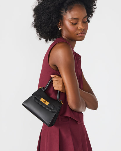 MADLYN Bag Black Structured Turn-Lock Closure Top-Handle Crossbody Mini Handbag | Steve Madden Featured