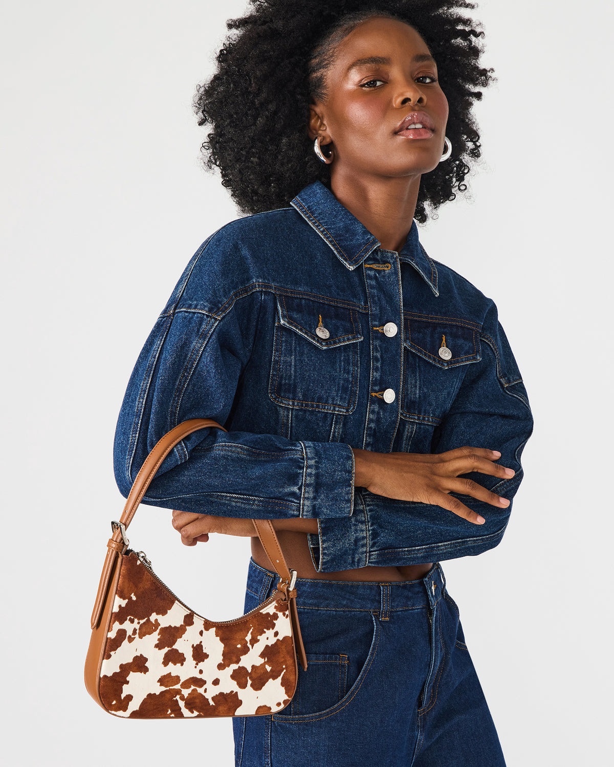 SMITH Bag Brown Cow Print Asymmetric Shoulder Handbag | Steve Madden Featured