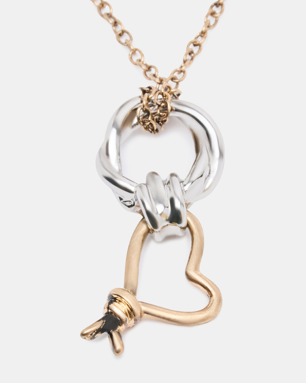 TWO TONE KNOT HEART PENDANT Necklace Double Knot Chain Necklace | Steve Madden Sale