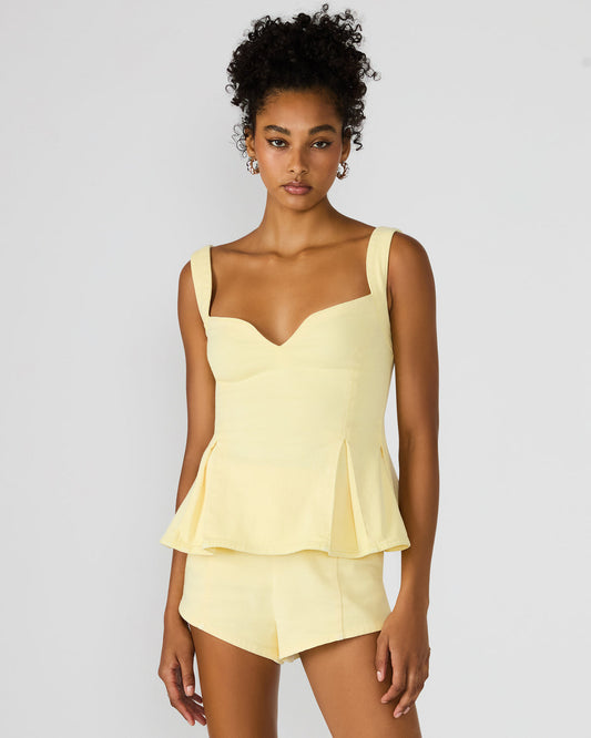 ZENIA Golden Glow Sleeveless Peplum Women's Top | Steve Madden Value